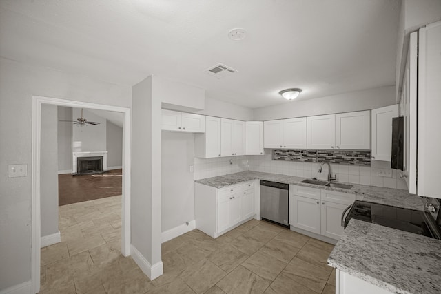 kitchen with white cabinetry, light stone countertops, stainless steel dishwasher, electric stove, and sink