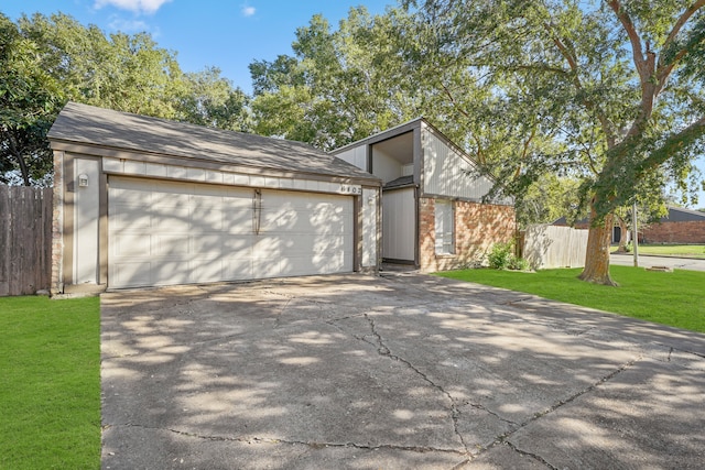 view of home's exterior featuring a yard and a garage