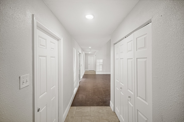 corridor with light hardwood / wood-style flooring