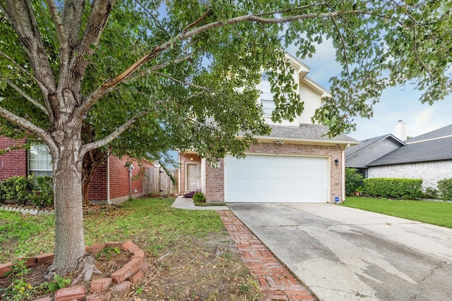 view of front of house with a front yard and a garage