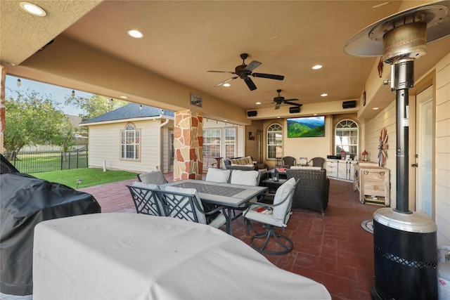 view of patio with outdoor lounge area, a grill, and ceiling fan