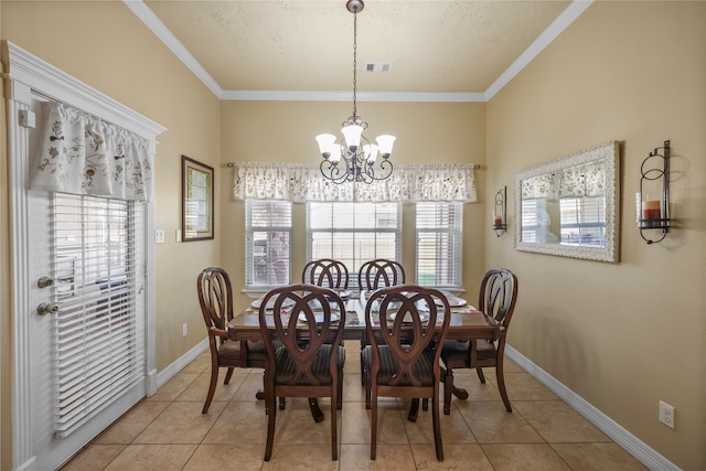 dining area with ornamental molding, light tile patterned floors, and a chandelier