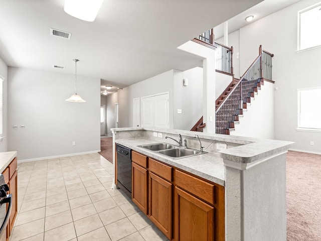 kitchen featuring pendant lighting, light tile patterned floors, sink, a kitchen island with sink, and black dishwasher