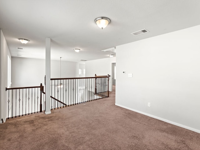 spare room featuring carpet floors