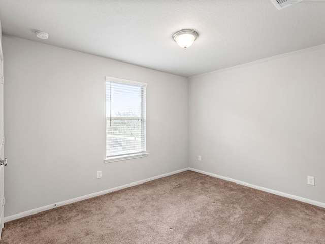 spare room with light colored carpet