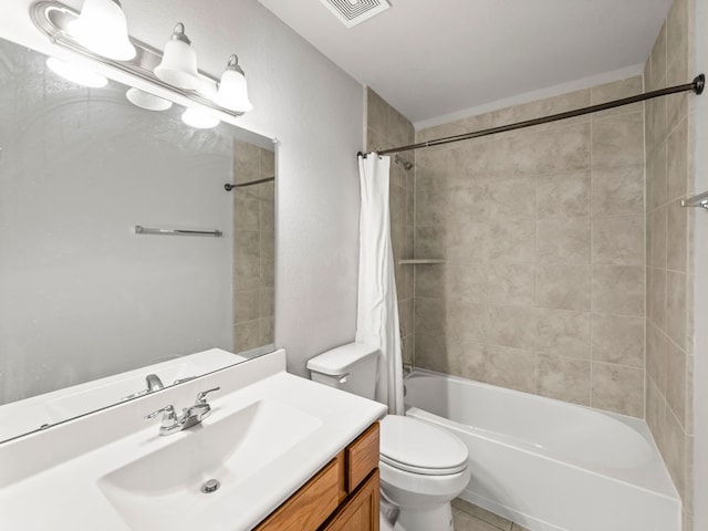 full bathroom with vanity, shower / bath combo with shower curtain, and toilet