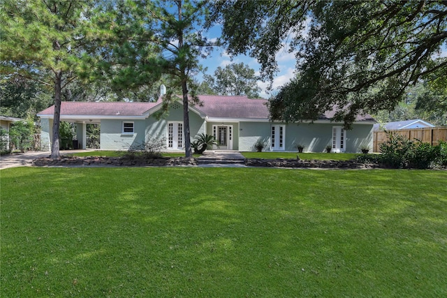 ranch-style house with a front yard and french doors