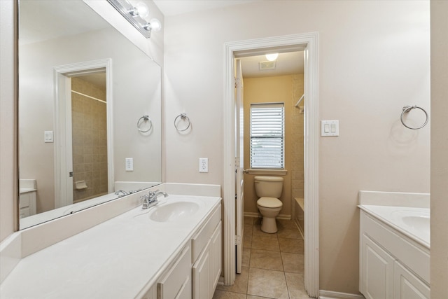 bathroom with vanity, toilet, and tile patterned floors