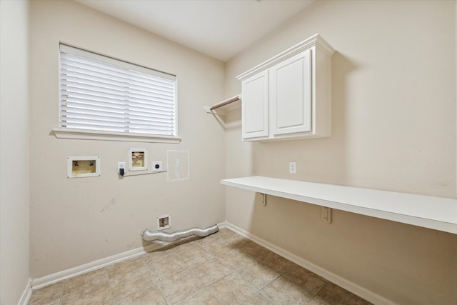 laundry area with washer hookup, cabinets, light tile patterned floors, and electric dryer hookup