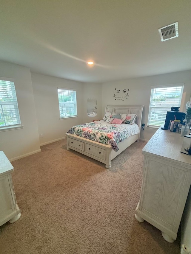 bedroom with light carpet