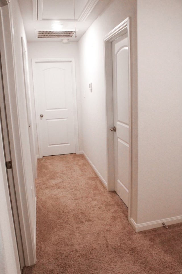 hallway with light colored carpet