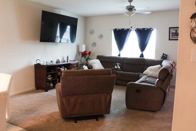 living room with carpet, ceiling fan, and plenty of natural light