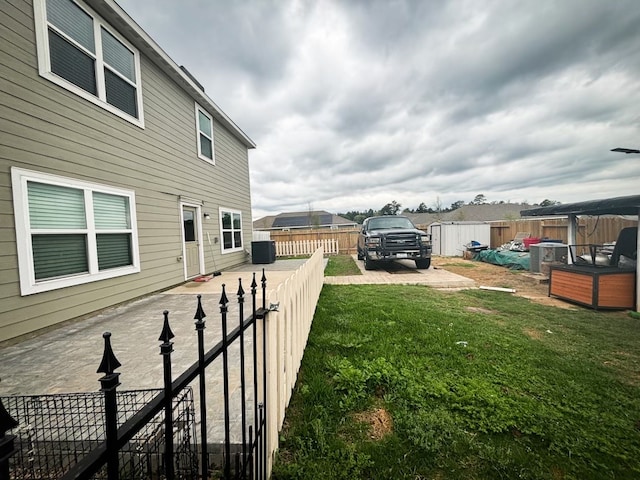 view of yard featuring central AC unit