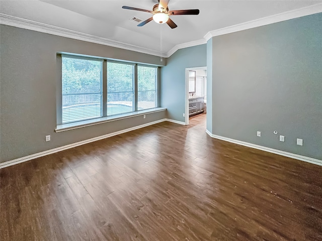 spare room featuring crown molding, dark wood-type flooring, and ceiling fan