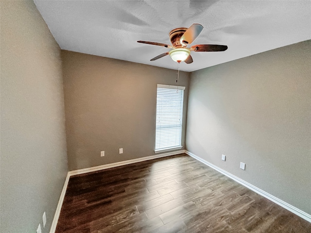 unfurnished room with ceiling fan and hardwood / wood-style floors