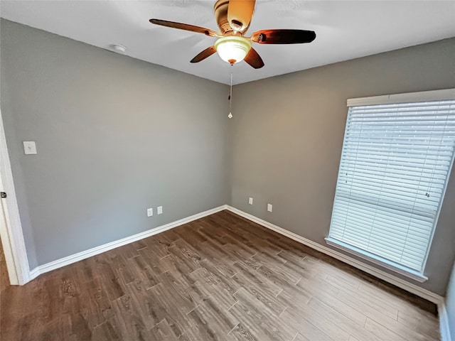 unfurnished room featuring ceiling fan and hardwood / wood-style flooring