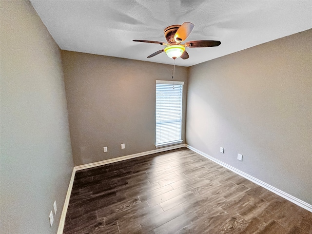 spare room with wood-type flooring and ceiling fan