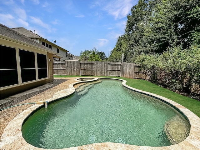 view of pool with a lawn