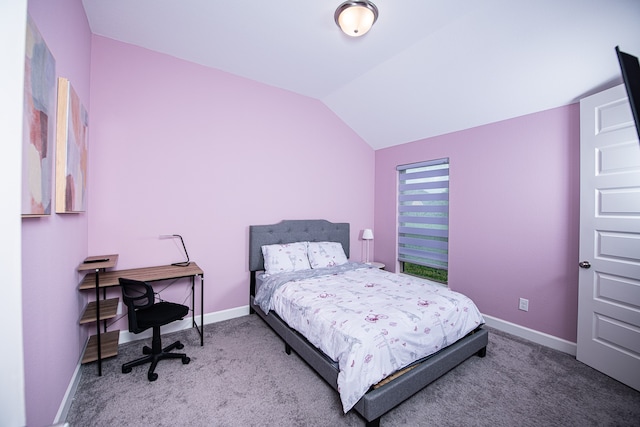 bedroom with vaulted ceiling and carpet