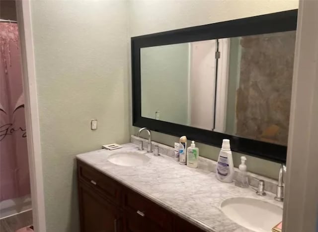 bathroom with vanity and a shower with curtain