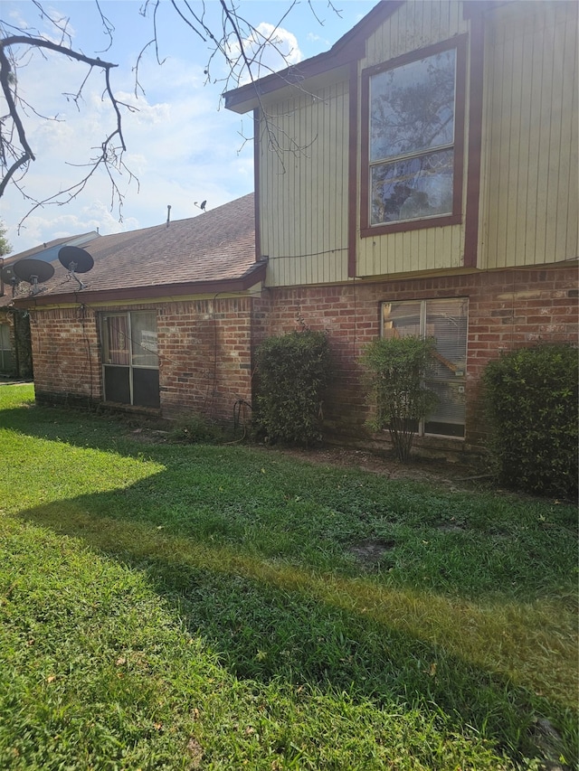 view of property exterior featuring a lawn