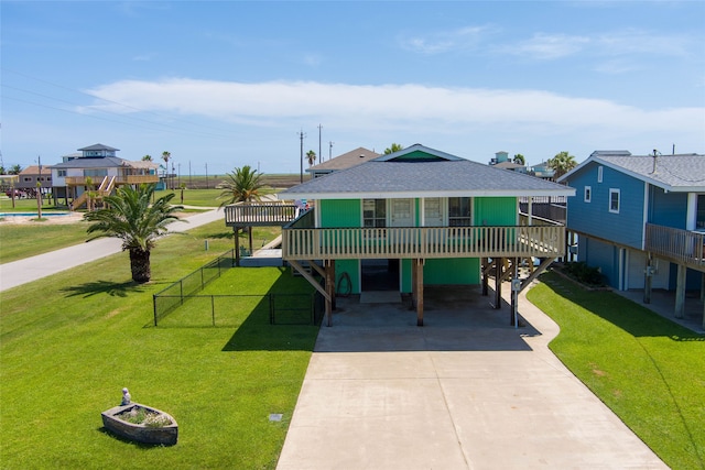 exterior space featuring a front yard and a carport