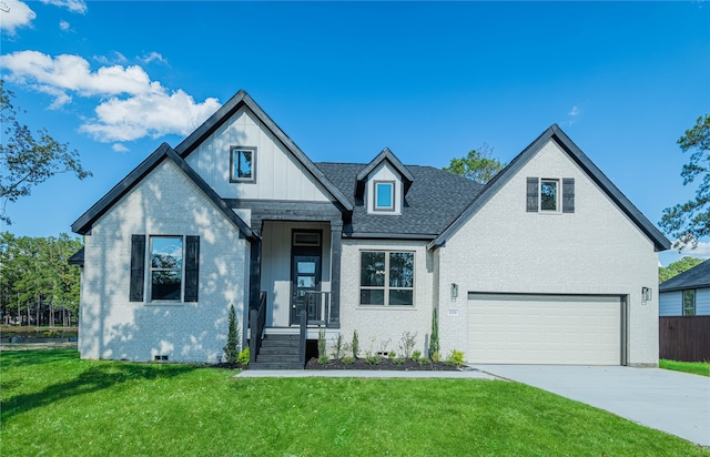 view of front of house with a garage and a front yard