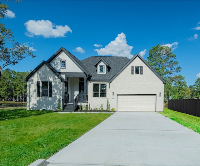 view of front facade with a garage and a front lawn