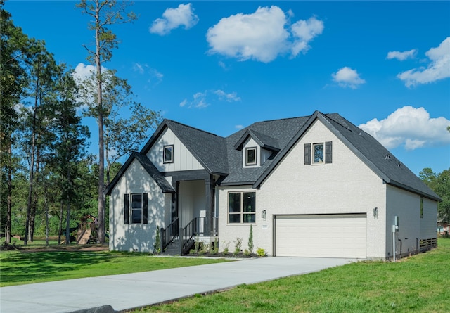 view of front facade with a garage and a front lawn