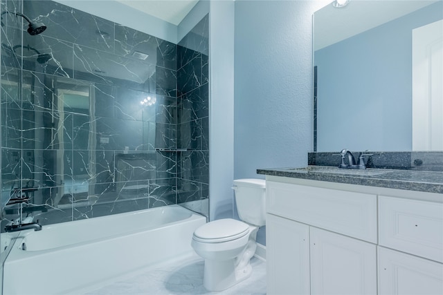 full bathroom featuring vanity, tiled shower / bath combo, and toilet