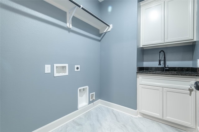 laundry room with hookup for a washing machine, hookup for an electric dryer, sink, and cabinets