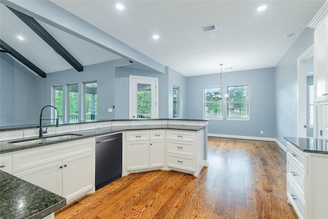 kitchen with white cabinets, sink, dishwasher, lofted ceiling with beams, and light hardwood / wood-style floors