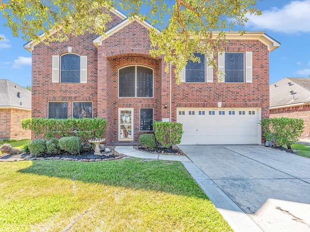 view of front of house featuring a front lawn and a garage