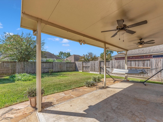 view of patio featuring ceiling fan