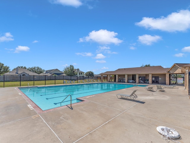 view of pool featuring a patio