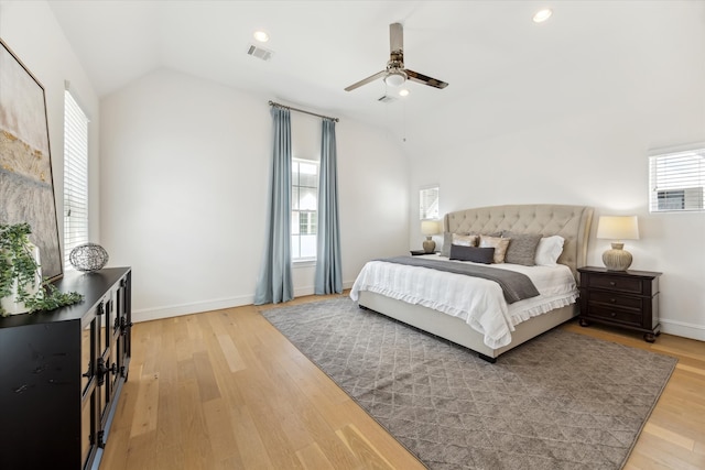 bedroom with lofted ceiling, hardwood / wood-style floors, and ceiling fan