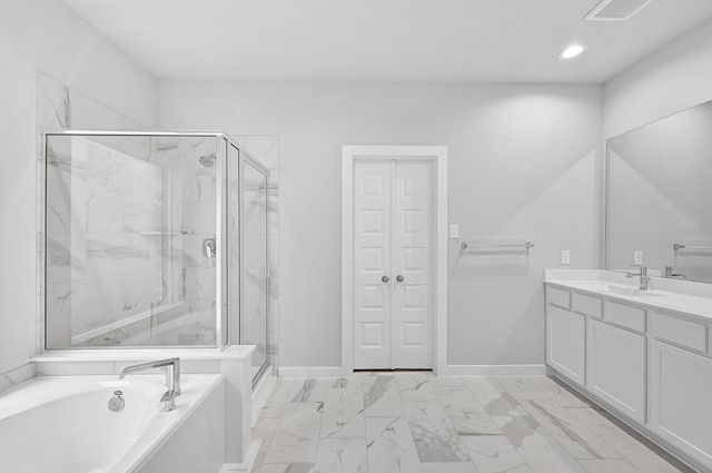 bathroom featuring vanity and separate shower and tub