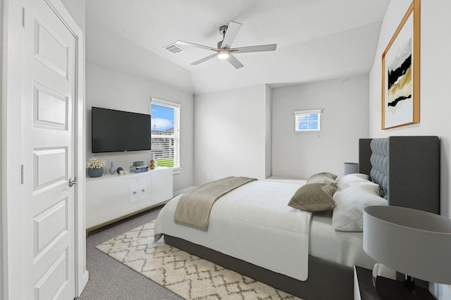 bedroom featuring vaulted ceiling, carpet flooring, and ceiling fan