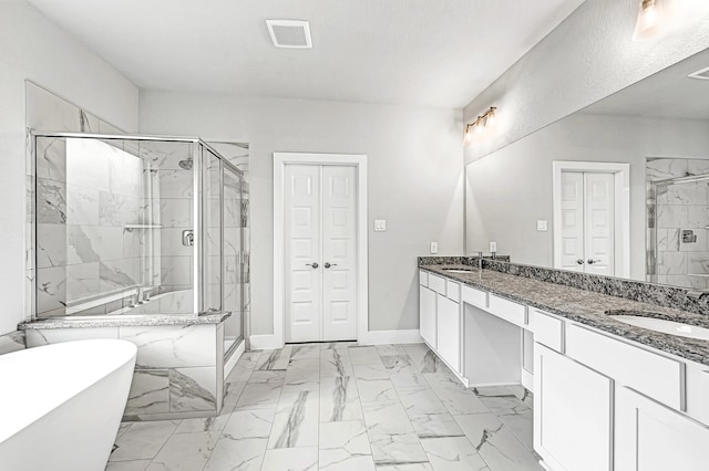 bathroom featuring vanity and shower with separate bathtub