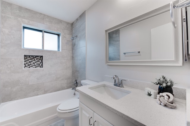 full bathroom with tiled shower / bath, toilet, and vanity