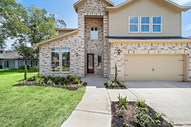 view of front facade featuring a garage and a front lawn