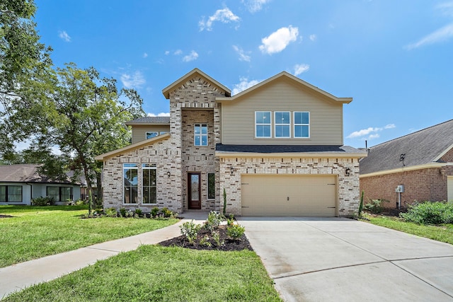 view of front facade with a front yard and a garage