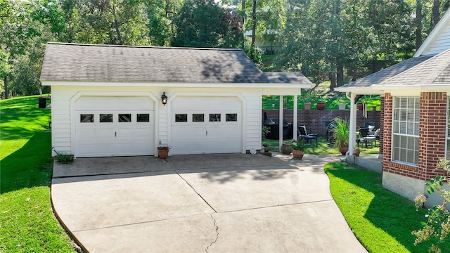 garage featuring a lawn