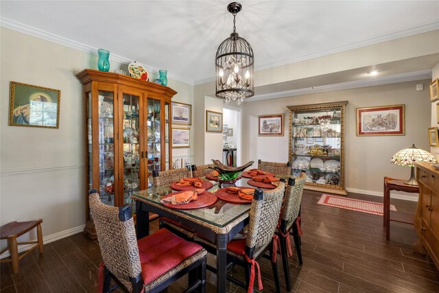 dining room with crown molding, dark hardwood / wood-style flooring, and a chandelier