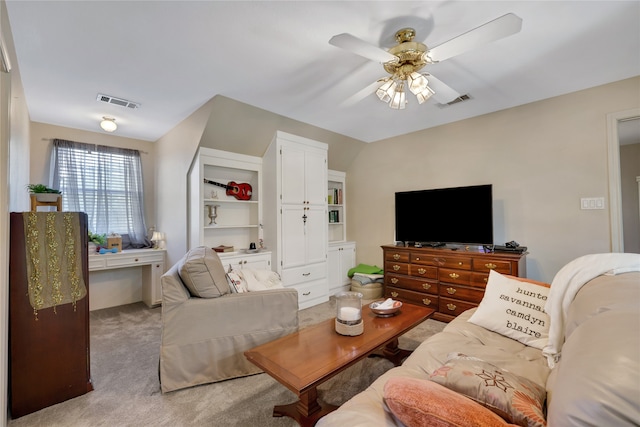 living room with ceiling fan and light colored carpet