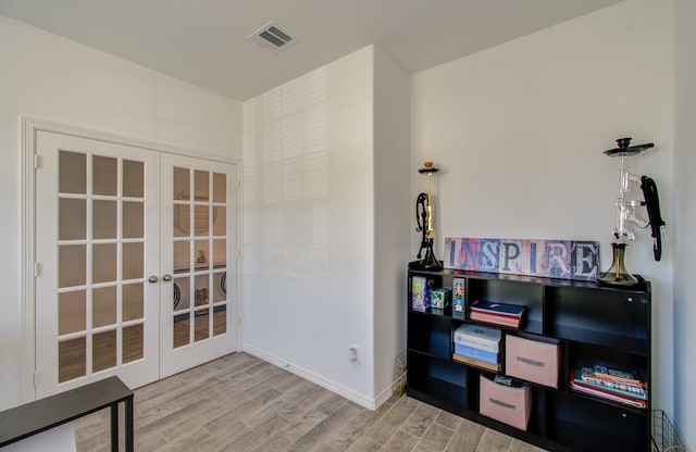 interior space featuring french doors and hardwood / wood-style flooring