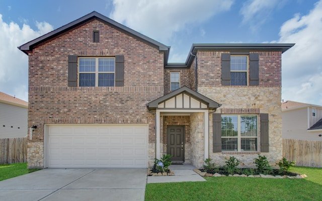 view of front property with a garage and a front lawn