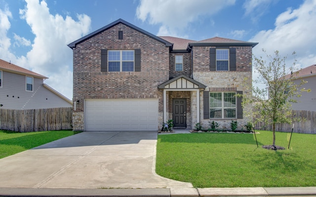 view of front facade with a front yard and a garage