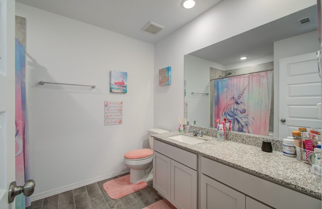 bathroom featuring walk in shower, vanity, hardwood / wood-style floors, and toilet