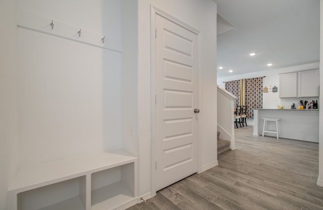 mudroom with light hardwood / wood-style floors